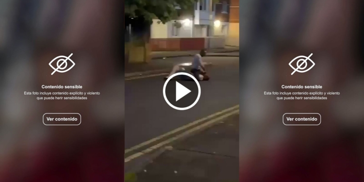 Salvaje intento de decapitación en Belfast: video sensible. Captura de pantalla de un video con advertencia de contenido sensible. Escena nocturna en la calle con una persona en el suelo.